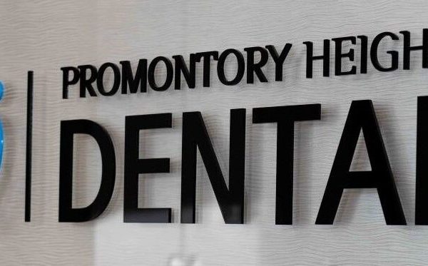 Promontory Heights Dental logo with a tooth and people icon, suggesting it as a dentist near you.