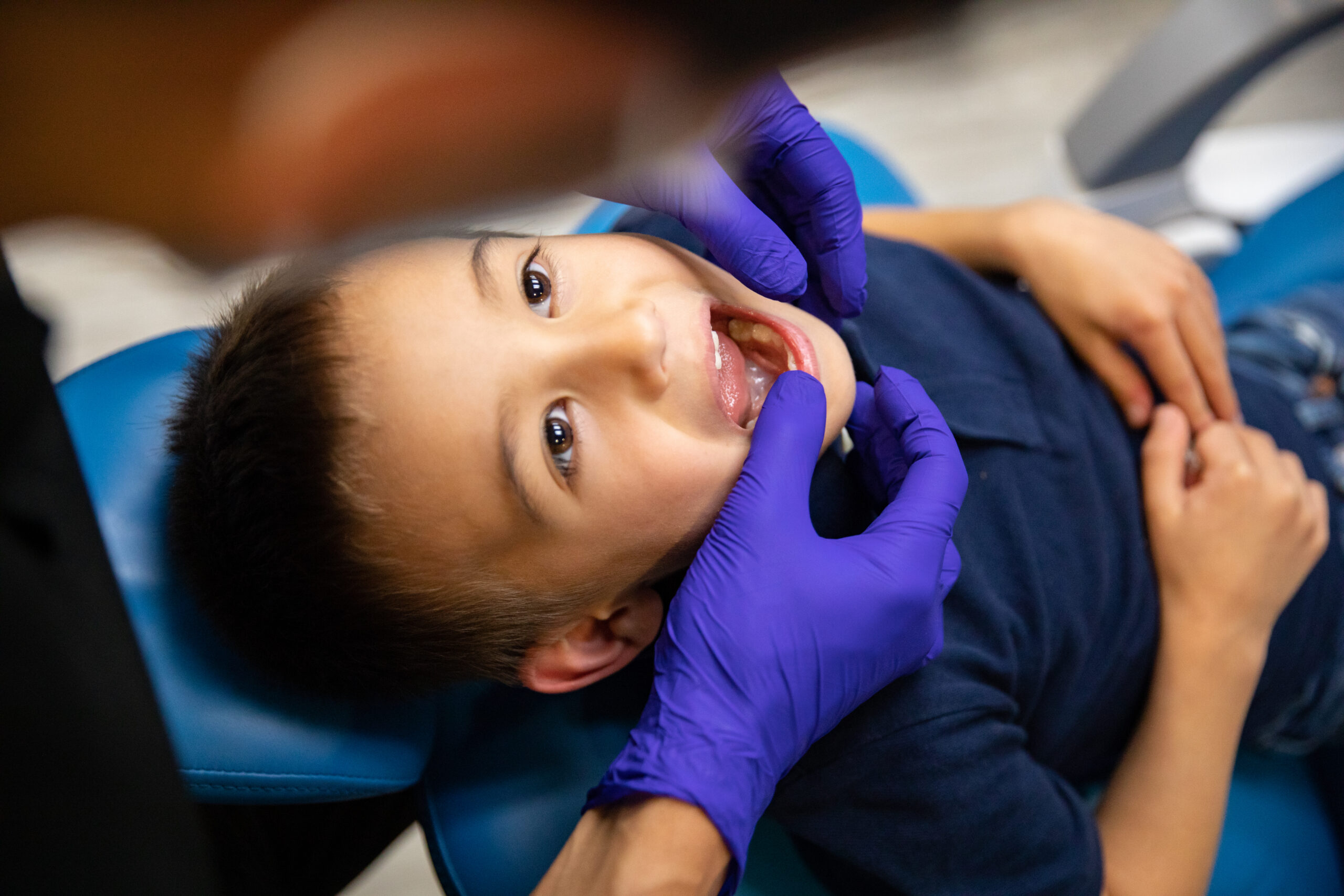 One of our dental professionals examining a child's teeth during a pediatric dental checkup