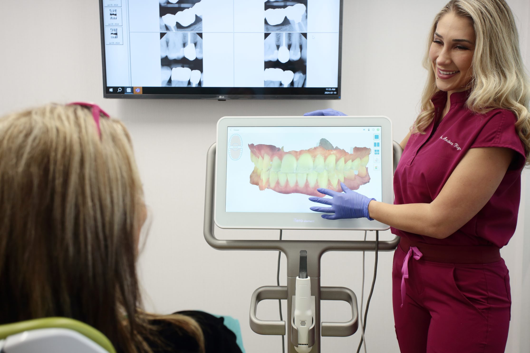 One of our dental professionals showing a 3D bite scan to a patient during consultation at our dental clinic